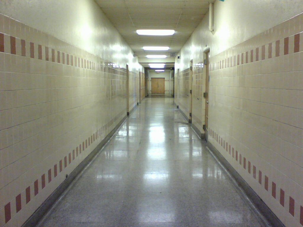 An empty high school hallway.