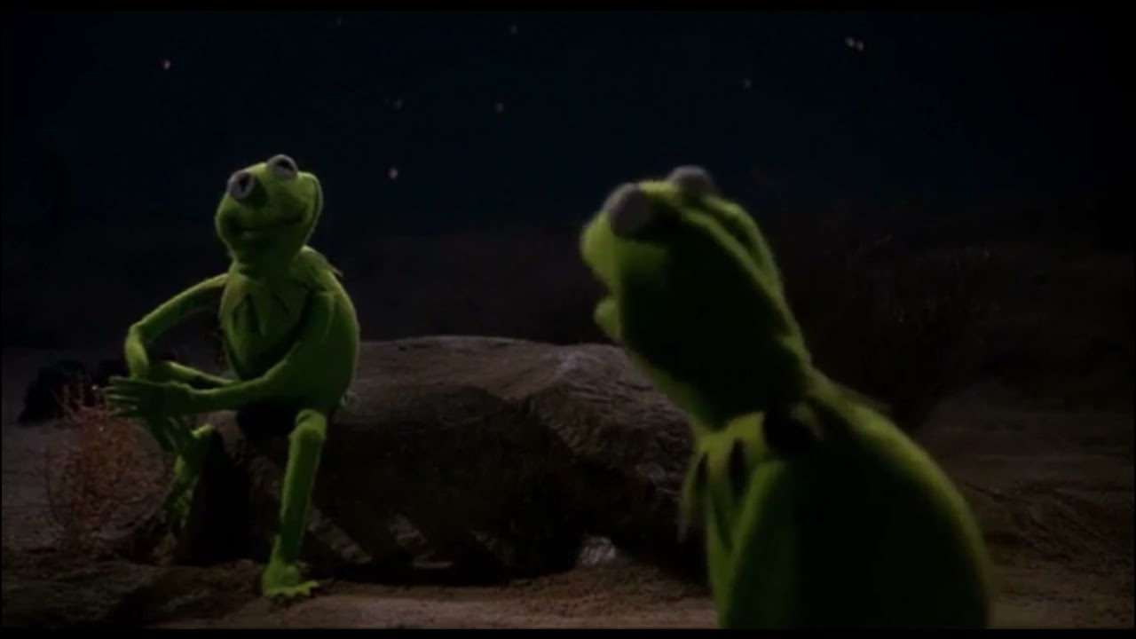 Kermit looking at a second Kermit across the desert at night, from The Muppet Movie.